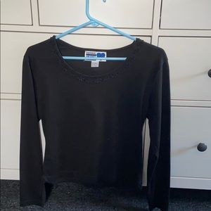 Black long sleeve. Shorter sleeves.